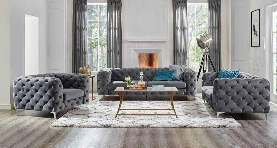 Modern living room with gray tufted sofa set and coffee table.