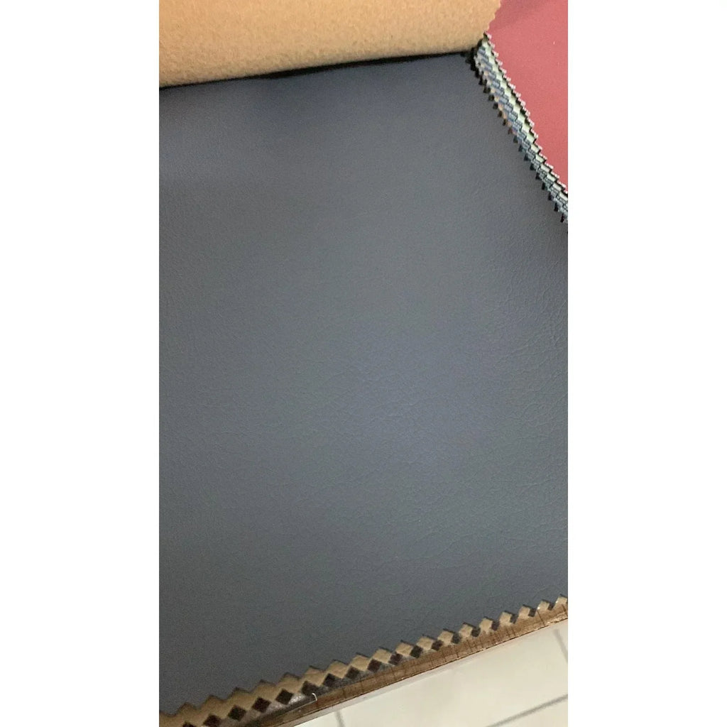 Roll of dark gray paper with a textured edge on a white background