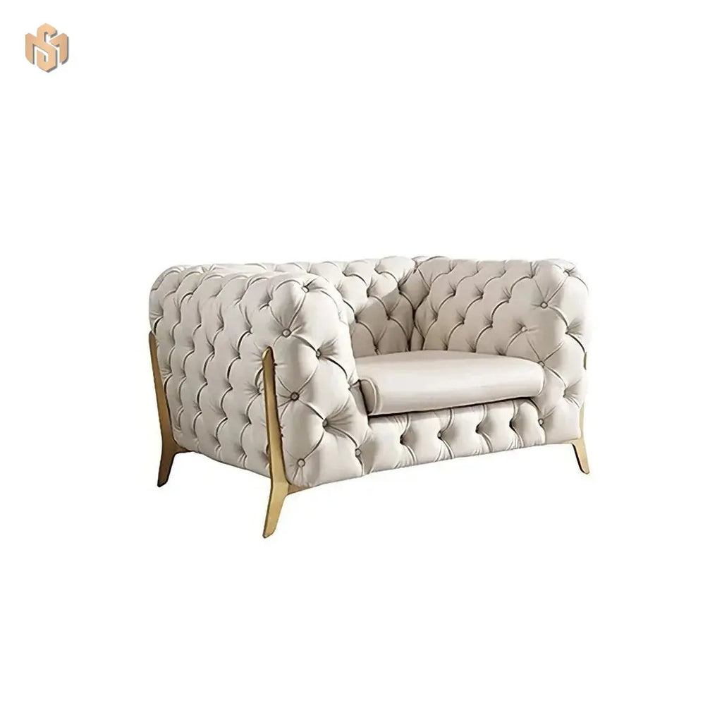 Light cream tufted sofa with wooden legs on a white background