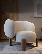 Modern beige armchair with wooden legs in a room setting