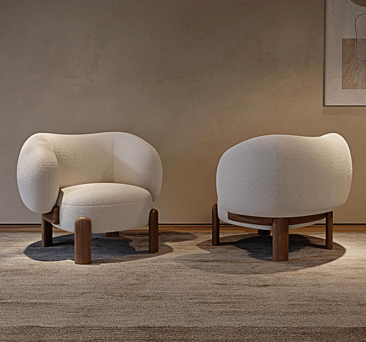 Two modern chairs with wooden legs in a room with a neutral wall and carpet.