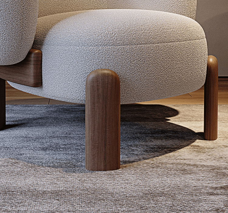 Close-up of a textured chair seat with wooden legs on a carpeted floor.