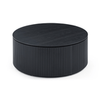Round black coffee table with ribbed texture on a white background