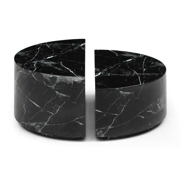 Two black marble cylindrical objects on a white background
