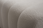 Close-up of textured beige fabric with a soft, plush surface.
