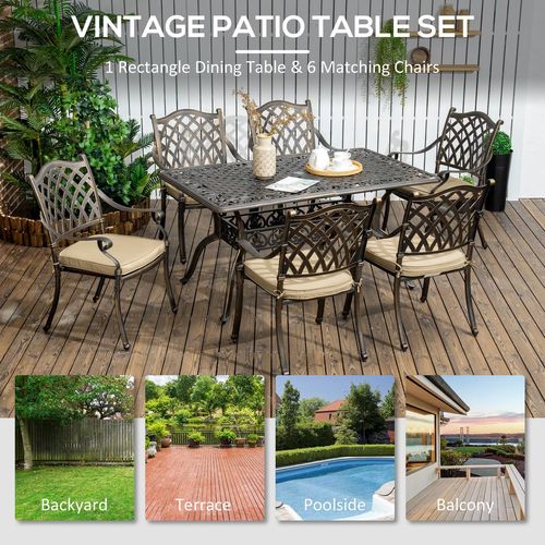 Vintage patio table set with 6 matching chairs on a wooden deck, surrounded by plants.