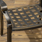 Metal chair seat with lattice design on a wooden surface