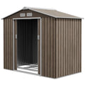 Brown metal storage shed with a white door on a white background