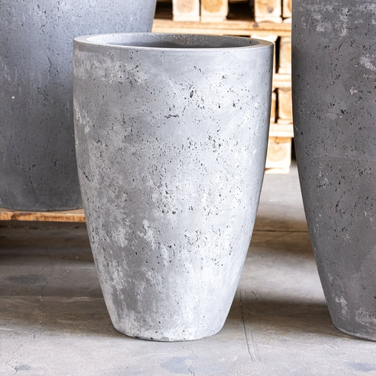 Concrete planters on a wooden pallet