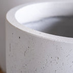 Close-up of a concrete planter with a smooth finish