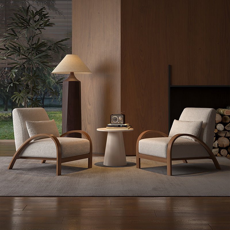 Two modern style armchairs, one with deep blue and brown lines, the other with beige and light brown lines, both with high-quality fabric seats, positioned in a room with a large window and a plant in the background.