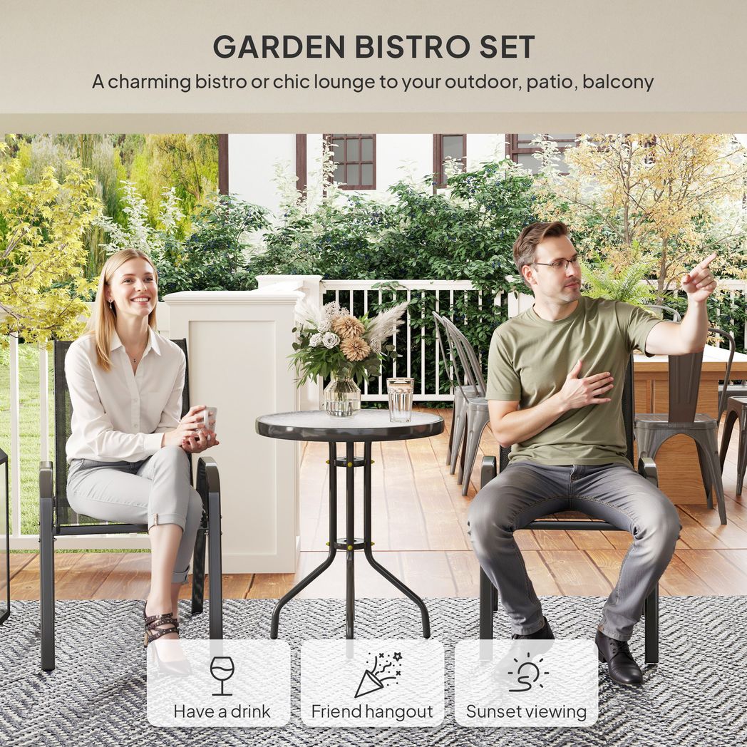 Garden bistro set with two people sitting on chairs and a table outdoors.